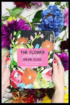 a person holding up a book with flowers around it and the title, the flower teacher online class