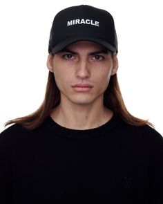 Black Trucker Hat With Miracle Motif. 57% Cotton 43% Nylon Miracle Motif Embroidered On Front Adjustable Snap Closure One Size Fits Most Black Hat With Embroidered Logo And Curved Visor, Black Trucker Hat With Embroidered Logo Curved Brim, Black Hat With Embroidered Logo And Curved Brim, Black Baseball Cap With Embroidered Logo And Short Brim, Black Hat With Embroidered Logo And Short Brim, Black Short-brimmed Baseball Cap With Embroidered Logo, Black Short Brim Hat With Embroidered Logo, Streetwear Hats, Black Trucker Hat