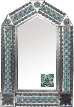 an ornate mirror with blue and black accents