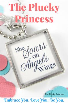 the plucky princess necklace has an angel's wing on it and says, she soars on angels wings