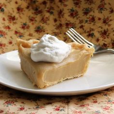 a piece of pie on a plate with a fork