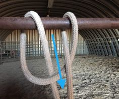 there are two ropes in the middle of an animal pen