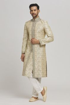 Ivory sherwani with floral embroidery. Paired with an inner kurta and pyjama. - Aza Fashions Off White Dabka Kurta For Reception, Cream Churidar For Reception In Transitional Season, Cream Churidar For Reception, Transitional Cream Churidar For Reception, Off White Straight Kurta Sherwani For Diwali, Festive Off White Straight Kurta Sherwani, Off White Sherwani For Eid, Cream Sherwani For Eid, Beige Straight Kurta For Reception