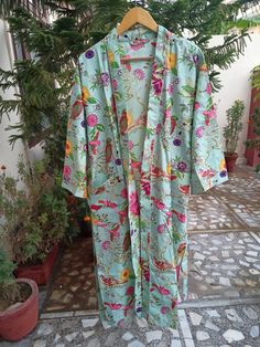 This Robe we makes from 100% Cotton printed fabric. The fabric print is Anokhi Floral which is very popular in all over the world . We use pure cotton cambric fabric . This is free One size robe . There is both side pocket in robe. Length = 120 cms. ( 48 inches) Beach Cotton Nightgown With Floral Print, Blue Bohemian Floral Print Sleepwear, Blue Bohemian Sleepwear With Floral Print, Bohemian Blue Floral Print Sleepwear, Green Floral Print Sleepwear For Home, Multicolor Cotton Dresses, Green Cotton Dress With Digital Print, Bohemian Cotton Floral Print Robe, Bohemian Cotton Robe With Floral Print