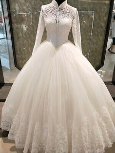 a white wedding dress on display in a store