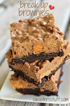 three brownies stacked on top of each other with chocolate frosting and peanut butter