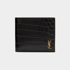 Saint Laurent wallet in crocodile-embossed calf leather with metal YSL monogram in the corner. Interior: two bill compartments, eight card slots, two receipt pockets. Approx. 3.7"H x 4.3"W x 0.9"D. Made in Italy. Designer Formal Wallets With Embossed Logo, Luxury Wallets With Crocodile Pattern For Business, Luxury Business Wallets With Crocodile Pattern, Luxury Crocodile Pattern Wallet For Business, Luxury Crocodile Pattern Wallets For Business, Luxury Crocodile Pattern Business Wallets, Luxury Formal Wallet With Crocodile Pattern, Luxury Bifold Wallet With Embossed Logo, Saint Laurent Wallet