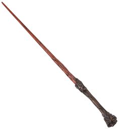 a long wooden stick with an intricate design on the top and bottom end is shown