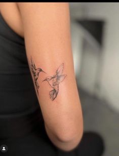 a woman with a hummingbird tattoo on her arm