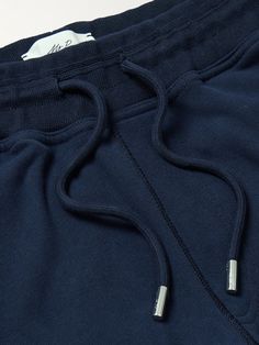 DESIGNED BY MR PORTER. Mr P. uses premium fabrics to create its refined, easy-to-wear staples. These sweatpants are made from plush cotton-jersey and have a comfortable tapered-leg shape. Wear yours with the coordinating sweatshirt. This product is part of Mr P.’s PERMANENT collection, a range of premium everyday staples designed to form the foundation of the modern man's wardrobe. Navy Cotton Sweatpants Sportswear, Navy Cotton Athleisure Joggers, Sporty Navy Cotton Joggers, Navy Cotton Sweatpants For Sports, Blue Cotton Sweatpants With Ribbed Cuffs, Navy Cotton Sportswear Joggers, Navy Cotton Joggers For Sportswear, Navy Cotton Joggers Sportswear, Navy Cotton Joggers For Loungewear