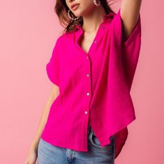 Stay stylish and comfortable with our light and effortlessly chic Charlotte Gauze Shirt, featuring short sleeves and button details. Woven Gauze Top: 100% Cotton Color: Fuchsia Relaxed Fit Model's Measurements: Height 5'7.5 | Bust 32 | Waist 25 | Hips 34 | Size S Pink Summer Shirt With Button Closure, Pink Button Closure Shirt For Summer, Summer Pink Shirt With Button Closure, Collared Short Sleeve Shirt With Rolled Sleeves For Spring, Trendy Pink Short Sleeve Top For Summer, Spring Rolled Sleeve Short Tops, Spring Short Sleeve Top With Rolled Sleeves, Short Sleeve Tops With Rolled Sleeves For Spring, Trendy Summer Shirt With Rolled Sleeves