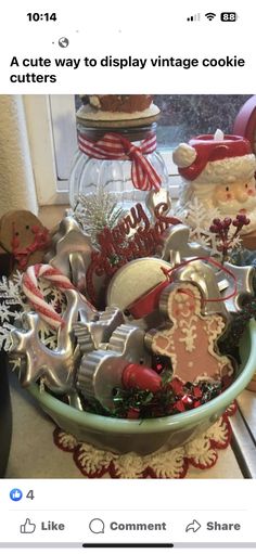 a bowl filled with lots of different types of cookie cutters and other holiday decorations