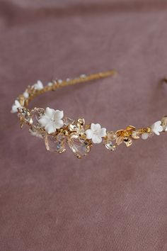 Filled with sparkling crystals and lots of gilded elements, a wedding headband, a bit in the boho style, but also fits into an elegant look, will beautifully decorate any wedding hairstyle. White flowers add charm and subtlety to the whole composition, which will certainly diversify the romantic wedding atmosphere. Length - 41 cm, width - 3.5 cm. Gold Wedding Hair Accessories, Gold Hair Accessories Wedding, Headpiece Wedding Hair, Bridal Halo, Wedding Hair Piece, Wedding Hairstyle, Bridal Headpiece, Wedding Headband, Wedding Tiara