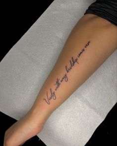 a woman with a tattoo on her leg that says, you are the only one who can