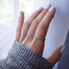 Delicate Sterling Silver Braided Ring-Beautiful, simple braid pattern -Delicate braided strands are Sterling Silver-This listing is for a single ring only. See photos for styling options-Please select size when orderingContact us with any questions about sizing or materials before ordering! Please see our FAQ section for shop policies, info on refunds/exchanges, and processing times. Please, message us with any questions!Copy/paste this link in your browser to join our VIP list for 10% off your Silver Braided Ring, Simple Braid, Triple Band Ring, Silver Flower Ring, Woven Ring, Braid Patterns, Single Ring, Braided Ring, Celtic Rings