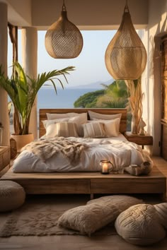 a large bed sitting in the middle of a bedroom next to a window with ocean view