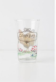 a glass with an image of a chicken and mushrooms on it that says good day