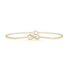 This stunning 14k yellow gold bracelet features an infinity knot that is partly adorned with sparkling diamonds. The prong set diamonds in combination with the lustrous metal look exceptionally elegant. This diamond infinity bracelet secures with a lobster claw clasp. Infinity Diamond Bracelet For Formal Occasions, Formal Infinity Diamond Bracelet, Infinity Diamond Bracelet With Accents For Anniversary, Elegant Infinity Bracelet With Diamond Accents, Elegant Infinity Bracelets With Diamond Accents, Elegant Infinity Chain Bracelet For Anniversary, Elegant Infinity Diamond Bracelet For Formal Occasions, Elegant Infinity Diamond Bracelet In White Gold, White Gold Infinity Diamond Bracelet