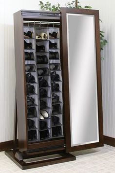 a large mirror sitting on top of a wooden stand next to a shelf filled with shoes