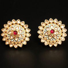 "Kundan Studs,Polki Emerald Studs earrings,Kundan Jhumka,Kundan Earrings,Kundan Jadau Stud Earrings,Kundan Jewelry,Kundan traditional earring These earrings are handcrafted with love and creativity and are perfect for any occasion. These handcrafted beautiful high quality earrings are made in Brass alloy in tribal handcrafted designs with matte gold finish paired with exclusive handwork. Pair them up with Indian traditional outfit such as Anarkalis, Lehengas or Sarees and be the \"Diva\" at your Round Meenakari Earrings For Puja, Meenakari Earrings For Puja, Round Shape, Meenakari Round Earrings For Puja, Meenakari Earrings For Puja, Traditional Round Earrings For Puja, Traditional Heavy Earrings For Puja, Traditional Chandbali Earrings With Zari Work, Traditional Kundan Jhumkas With Motifs, Temple Jewelry Earrings With Motifs