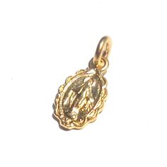 This is the smallest size of Mother Mary pendant what I have. I guarantee gold purity over 99.8%. If customer want to bigger size of Miraculous pendant, please visit my own webstore then I can make all different size and different gold weight. 14k and 18k gold are available. If you want lower cost and no tax, Please visit my local webstore. *Material :24K pure Gold(hall-marked, 99.9% ) *Weight: 24k:about 1.6gram, 14k: about 0.8gram *16mm x 7mm with bail *Chain is not included * Authorized Gem Ce 14k Gold Spiritual Miraculous Medal Jewelry And Charms, 14k Gold Spiritual Miraculous Medal Jewelry, Yellow Gold Miraculous Medal As Gift, 14k Gold Miraculous Medal As Gift, 14k Gold Miraculous Medal As A Gift, Gold Oval Pendant Spiritual Jewelry, Gold Spiritual Charms And Jewelry, Spiritual 14k Yellow Gold Charms, Spiritual 14k Gold Charms