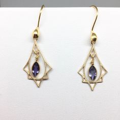 "Art Deco lovers here are purple Amethyst and gold earrings! So often we see Art Deco designs that are only red and gold but I also make Art Deco with many gemstones. These sweet earrings are lightweight and easy to wear. The faceted Amethyst stones are set in Vermeil gold that dangle freely within a Vermeil gold Art Deco charm that has a soft brushed finish. They hang 1.5 inches on Vermeil gold ear wires with a gold accent. These also make a wonderful gift for someone born in February since Ame Purple Vintage Jewelry, Purple Art Deco Jewelry For Formal Occasions, Purple Art Deco Jewelry For Wedding, Purple Art Deco Jewelry For Formal Events, Art Deco Purple Jewelry For Formal Occasions, Purple Earrings With Intricate Design For Gift, Purple Earrings With Intricate Design As Gift, Art Deco Gemstone Earrings For Gift, Art Deco Amethyst Jewelry Gift