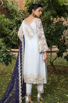 Elegant Chiffon Party Dress In White Color is a beautiful attire and a modern pick if you are looking for Pakistani Party Dresses. This ethereal white dress with its pretty adornments is perfect to style on any special event or party making you the center of the event. Kameez: This ethereal white Long Kameez comes in fine quality chiffon imparting it dreamy insights. This Pakistani Dress is adorned with fine embroidery and tilla in floral patterns. This kameez is very elegant because of its soft Festive Reception Dress With Sheer Sleeves, White Georgette Dress With Pearl Embroidery, Festive Sheer Georgette Dresses, White Formal Dresses With Dupatta, White Chiffon Dress For Summer Evening, White Chiffon Evening Dress For Summer, Blue Evening Dress With Dupatta, White Chiffon Summer Evening Dress, Sheer Georgette Dress For Eid