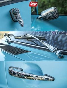 the door handle on a blue car is decorated with intricate designs and metal handles,