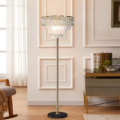 a floor lamp in a living room next to a chair