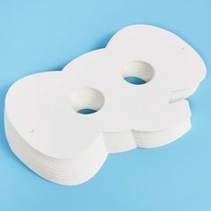 two white toilet paper holders on a blue background