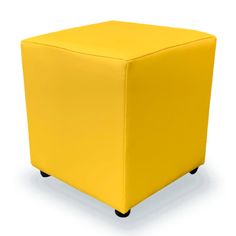 a yellow cube ottoman sitting on top of a white floor