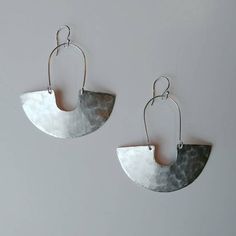 Minimalist Silver Hammered Earrings, Minimalist Hammered Silver Earrings, Everyday Silver Hoop Earrings With French Hook, Silver Hoop Earrings With French Hook, Modern Hammered Earrings For Everyday, Silver Dangle Hoop Earrings With French Hook, Modern Metal Earrings With French Hook, Everyday Silver Earrings With French Hook, Silver French Hook Earrings For Everyday