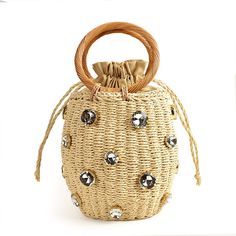 Crystal Embellished Straw Bucket Bag - 3 Colors. Cutest straw bucket bag with ring handle with big crystal rhinestone embellishement. Draw string cloure. Great alternative to rattan basket bags. SIZE: Top/Bottom Diameter 16cm/12cm x H18 cm; Handle Mid H 10cm Gender: WOMEN Item Style: Handbag, Top Handle Bag Shape: Bucket Number of Handles/Straps: Two Main Material: Paper Straw Lining Material: Canvas Interior: No Pocket Decoration: Imidation Diamonds Crystal Closure Type: STRING Rattan Handbags, Inspired Handbags, Small Buckets, Bucket Handbags, Brown Flowers, Wicker Bags, Rope Bag, Pearl Bag, Rattan Bag