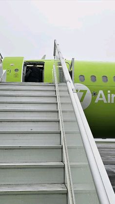 an airplane with stairs leading up to it