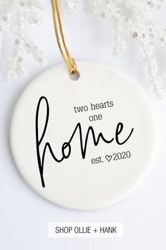 two hearts one home ceramic ornament on a white background with snowflakes