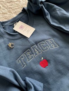 Teaching Shirts Ideas, English Teacher Aesthetic Outfits, Daycare Outfits Teachers, Teacher Embroidery Designs, Teacher Jacket, Kindergarten Teacher Outfits, Teaching Fits, Teacher Appropriate Outfits, Teach Sweatshirt