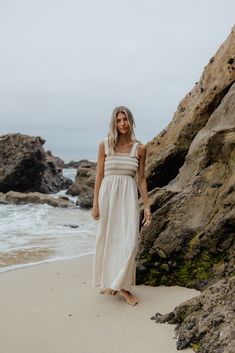 The smocked dress that swept us off our feet! The prettiest tie straps and smocked bodice makes for the comfiest and cutest dress! Have you ever seen a cuter dress? Fits true to size. Model Info: Taylor is 5'9 wearing size Small. Fabric Info: 80% linen 20% cotton Beige Ruffled Strap Dress For Beach, Beige Beach Dress With Ruffled Straps, Bohemian Smocked Dress With Ruffled Straps, Beige Casual Maxi Dress With Tie Straps, Casual Beige Maxi Dress With Tie Straps, Beige Beach Dress With Smocked Bodice, Beige Beach Dresses With Smocked Bodice, Beige Vacation Dress With Smocked Back, Beige Dresses With Smocked Bodice For Beach