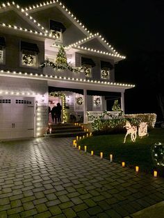 a house decorated with christmas lights and decorations