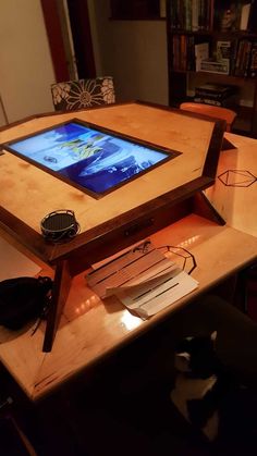 a tablet sitting on top of a wooden table