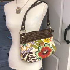 Fabulous Purse, Measurements Are In The Photos. Not A Shoulder Strap, Zipper Top New Without Tags. Canvas Type Material, Man-Made Leather Trim. Casual Brown Fabric Shoulder Bag, Casual Brown Fabric Bag, Vintage Brown Shoulder Bag With Floral Print, Vintage Brown Floral Print Shoulder Bag, Spring Brown Shoulder Bag With Zipper Closure, Brown Shoulder Bag With Zipper Closure For Spring, Brown Floral Print Shoulder Bag, Casual Brown Floral Print Bags, Brown Floral Print Crossbody Shoulder Bag