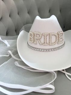 a white hat with the word bride written on it