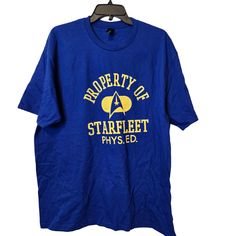 a blue t - shirt that says property of star trek