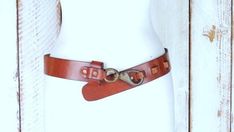 "Vintage wide thick brown leather brass hook buckle saddle belt/boho leather belt/34 Measurements... -marked size: 34 -fits sizes: 31\" - 34\" -total length: 40\" -width: 1 5/8\" Features... -thick wide genuine leather -heavy brass hook buckle -hook is stamped Japan Condition... -great vintage condition -some leather scratches/marks AB1947" Brown Leather Belts And Suspenders With Brass Hardware, Rustic Brown Belts And Suspenders, Brown Bohemian Belt With Brass Buckle, Antique Brown Belt Buckle For Festival, Purple Snake, Brass Hook, Boho Leather, Le Crochet, Suspender Belt