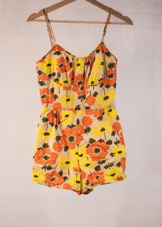 Lovely 50s poppy print playsuit in XXS/XS. Playsuit is in excellent condition with no holes, stains, fading, or other signs of wear, but the tag has been ripped out. Perfect for a relaxing day at the beach or by the pool. Super soft cotton with a mesh lining and shelf bust.  measurements: playsuit: bust- 28"-32" waist- 22"-24" hips- 35"-36" **NOTE** Due to fees increasing on etsy, all items are discounted if purchased via IG @MeasureTwiceVintage 40s Playsuit, 1950s Playsuit, Vintage Playsuit Pattern, Yellow Cotton Playwear Bottoms, Pink Floral Print Playwear Sets, Womens Jumpsuits, Poppy Print, Day At The Beach, Relaxing Day