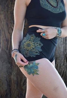 Crystal Mandala High Waisted Hot Shorts - Glow in the Dark Sacred Geometry Yoga ShortsThese comfortable and stylish black high waisted hot shorts features a glow in the dark and metallic gold screen print of my hand drawn Crystal Mandala. This original design also includes a metallic gold print of my simple Metatron's Cube, which I made specifically to layer and align with the geometry of my more detailed Crystal Mandala. This gold layer also includes the Platonic Solids and the Seed of Life in Black Short Length Rave Bottoms, Green Festival Bottoms With Built-in Shorts, Green High-waisted Shorts For Yoga, Festival Green Bottoms With Built-in Shorts, High Waist Bottoms With Built-in Shorts For Festival, Stretch Festival Bottoms, Fitted Green Bottoms For Festival, Green Festival Bottoms Short Length, Fitted Rave Bottoms For Music Festival