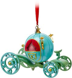 an ornament shaped like a horse drawn carriage