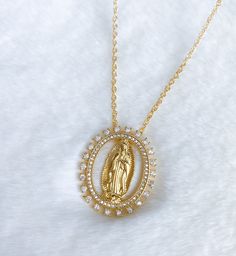 Virgen de Guadalupe necklace MATERIAL AND SIZE 18k gold filled chain Cubic zirconia Size pendant: 2.7cm Length chain: 45cm or 18 inches If you have questions about the product, feel free to reach me out. Don't forget to check out my other items in the store: Https://www.etsy.com/shop/nyahwithlove Virgen Maria Necklace, Quinceanera Jewelry Necklaces, Mexican Necklaces, Virgencita Necklace, Guadalupe Necklace, Quinceanera Jewelry, Jesus Necklace, Mary Necklace, Virgin Mary Necklace