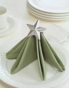 folded napkins with silver stars on them