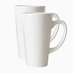 two white coffee mugs sitting next to each other on a white surface with no one around them