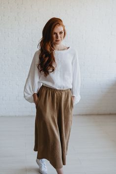 "Camel Linen Skirt, Heavy Weight Linen Skirt, Linen Midi Skirt,  ♠ Effortless long skirt that is made of 100% pure linen. Featuring an elastic waist and side pockets, this rich maxi skirt looks feminine while being super comfy and breezy. Made from natural washed and soft heavyweight linen that has a thick texture and is perfect for the chilly weather.  ♠ Sizes The model on the picture is 165 cm/5'5\" tall and is wearing size S. Have a look at my Size Chart below to make sure your piece will fit you best. ** Custom Orders For any changes or adjustments you may need, please contact us before making a purchase. The amount of the additional payment depends on the type of customization requested. Please allow additional time for custom sized orders. Please note that we cannot accept returns or Elegant Long Skirt With Relaxed Fit, Relaxed Fit Gathered Midi Skirt, Casual Long Skirt With Loosely Fitted Hips, Relaxed Fit Pleated Skirt, Relaxed Fit Mini Skirt With Lining, Relaxed Fit Long Gathered Skirt, Long Gathered Skirt With Relaxed Fit, Beige Skirt With Elastic Waistband And Relaxed Fit, Fall Linen Long Skirt